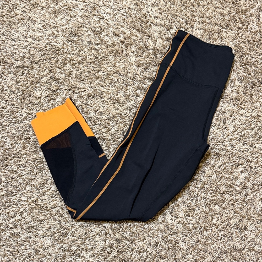 ZYIA NFL Pocket Leggings in Black and Orange